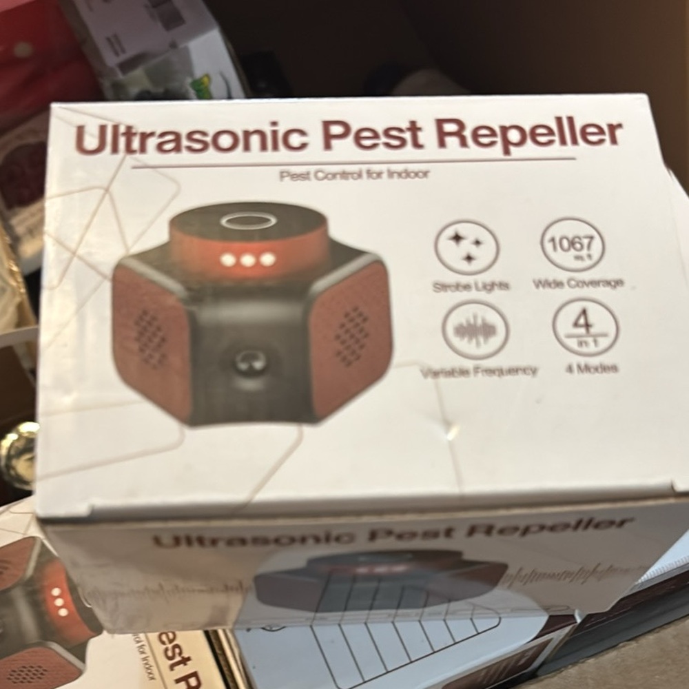 Ultrasonic Pest Repeller with Red and Black Design